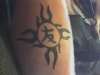 sun with tribal tattoo