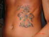 Cross on my ribs tattoo