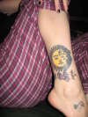 Sun/moon/tribal etc tattoo