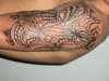 left arm (twisted metal) tattoo