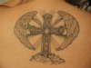 Cross with wings tattoo