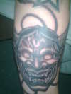 hanging mask tattoo
