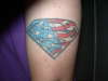 Superman Symbol Superimposed Over a U.S. Flag tattoo