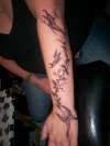 Black/grey flowers/butterflies tattoo