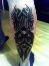 bottom leg tattoo