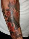 carp on lower arm tattoo