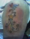 stars top arm tattoo