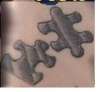 Metal Puzzle Pieces tattoo