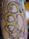 Brass knuckles tattoo