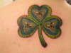 Three leaf clover with Holy Trinity tattoo