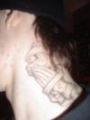 Prying hands and cross tattoo