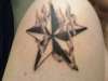 smokey nautical star tattoo