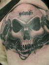 3 Skulls in Barbed Wire tattoo
