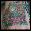 owl sittin ina rose tattoo