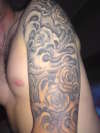 roses waves half sleeve tattoo
