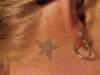 star on my wife's neck tattoo