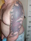 Tribal muscle tissue tattoo