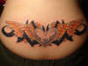 orange wings tattoo