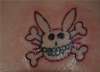 Happy Bunny "Cute but Evil" tattoo