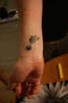 Winged Note tattoo