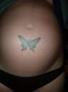 Butterfly on tummy tattoo