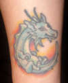 green baby dragon tattoo