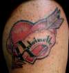 Heart and arrow tattoo