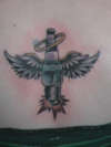 Spark plug with wings tattoo