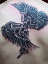 Winged cross tattoo