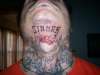 Throat piece tattoo