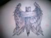 cross and wings tattoo