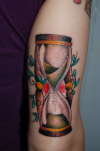 Traditional hourglass tattoo