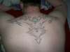 Tribal back piece tattoo