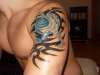 surfing tat, wave and tribal tattoo