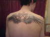Heartagram with wings tattoo