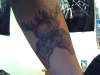 skull and guitars tattoo