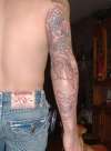 dragon and skulls tattoo