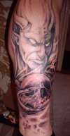 Milosch devil and skulls tattoo