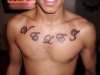 Chest lettering tattoo