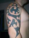 Black tribal half sleeve tattoo