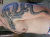 dragon on arm and shoulder tattoo