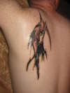 tribal reaper tattoo