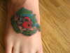 lady bug on my foot tattoo