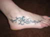 Butterfly with vines tattoo