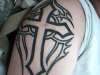 my cross with tribal behind it tattoo