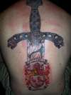 family sword and coat of arms tattoo