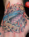 Seven's Hand tattoo