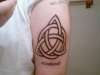freehand celtic know with my last name under tattoo