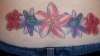 passion flower, hibiscus, plumeria tattoo