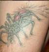 spider ripping out tattoo